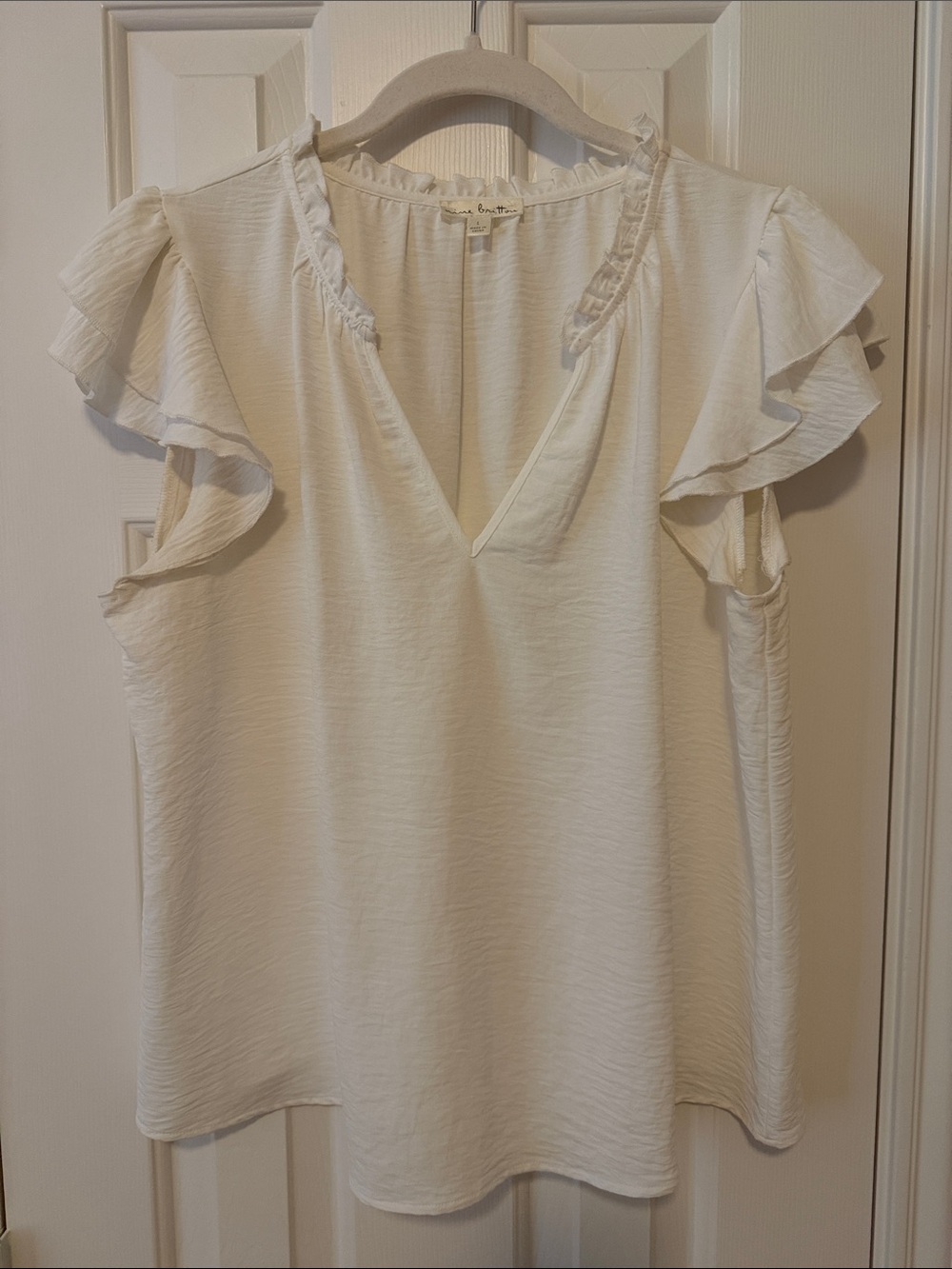 nine britton Ivory Ruffled Sleeve V-Neck Blouse
